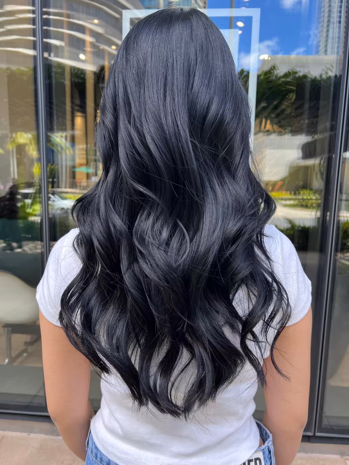 Long glossy black hair with loose waves and dark sheen, back view - dark hair color Honolulu